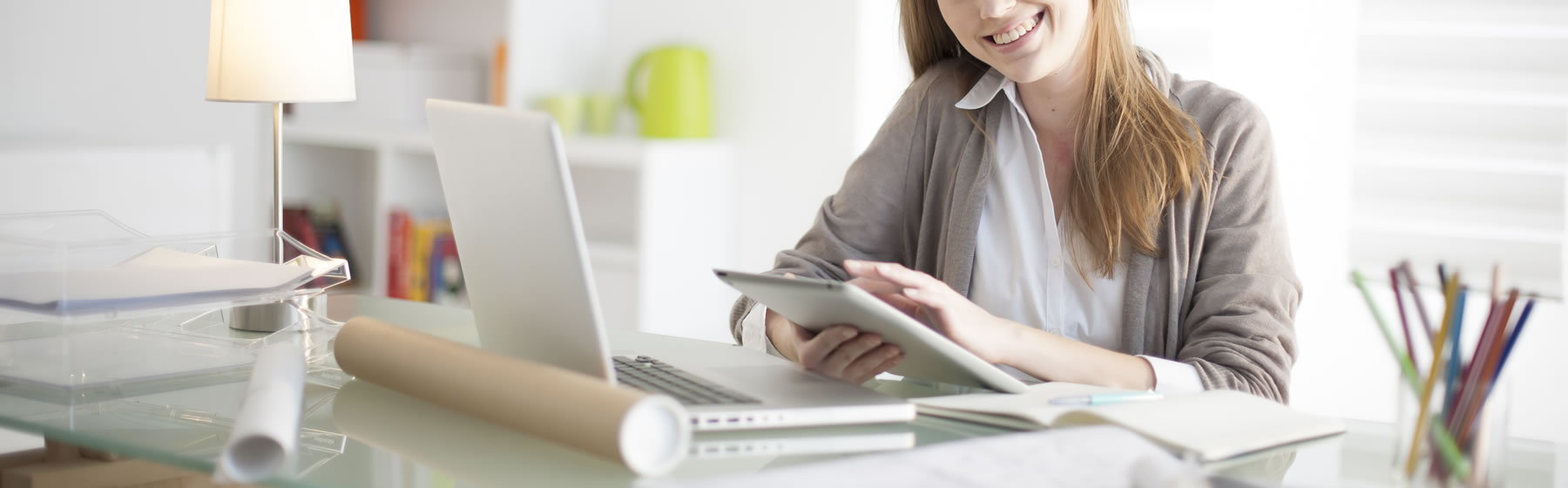 Working in an office at a desk with iPad